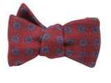 Red bow tie with blue geometric pattern